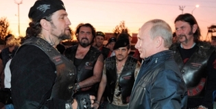 Putin staring at a biker man much taller than him